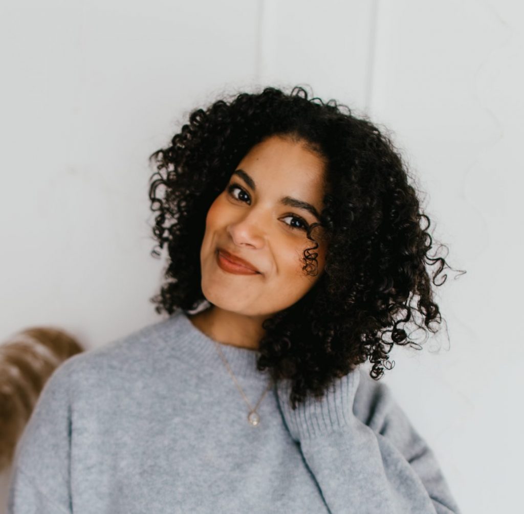 business owner naturally curly hair